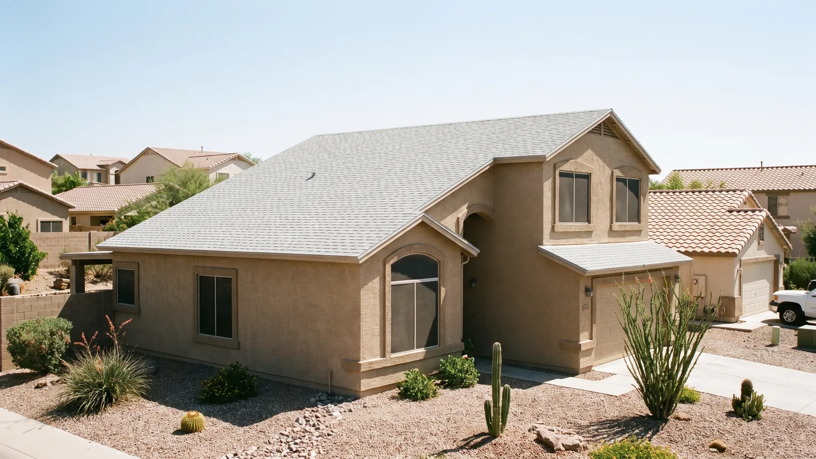 New architectural shingle roof on a two-story stucco home in the West Valley of Phoenix